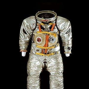 Suit: A4-H, Prototype. Year: 1965. Created by Hamilton Standard, this suit was designed for Apollo training purposes only. Suits are tested in a pool alternatively known as a Weightless Environment Test Facility. The nylon 
and aluminum suit is filled with air, as it would be in space, and weights are strapped around the tester’s waist. Testing underwater simulates the weightless feeling of being in space. (Smithsonian National Air and Space Museum)