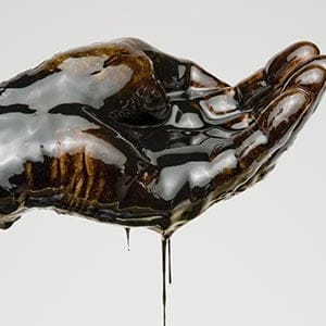 Hand Full of Oil.  Getty Images