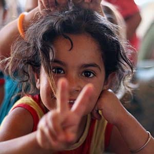 Victory (June 17/2015)
Her unkempt hair was free and wild.
She was lively and giggled at the little things. Like the sound of the other children singing. 
"Smile!" I told her before snapping a photo. She threw her had back chortling. 
(Priscilla Hwang)