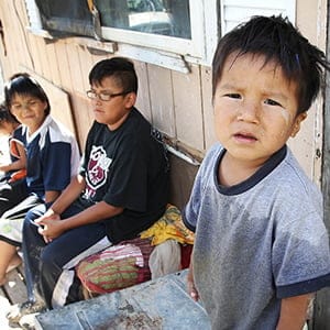 Children outside the trailer of Richard Andrews in Wasagamack First Nation.  It is in filthy condition, has mold and is overpopulated by over 13 people living inside. It has  no running water- See Mary Agnes No Running Water Feature ñ August 18, 2011. (Joe Bryska/Winnipeg Free Press)