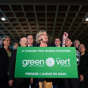 Green Party Leader Elizabeth May, centre, is flanked by local candidates while speaking during a campaign event in Vancouver, B.C., on Wednesday September 9, 2015. A federal election will be held October 19. (DARRYL DYCK/CP)