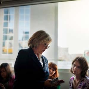 Elizabeth May looks at her phone. (Gio Ciampini/Green Party)