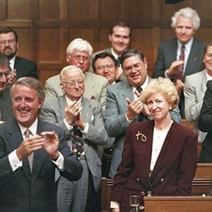 Kim Campbell, Leader of the Conservative Party and Prime Minister designate is given a standing ovation in the House of Commons by Prime Minister Brian Mulroney and other members of the government on June 16, 1993. (Tom Hanson/CP)