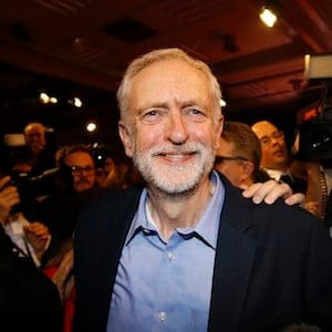 Jeremy Corbyn smiles as he leaves the stage  after he is announced as the new leader of The Labour Party during the Labour Party Leadership Conference in London, Saturday, Sept. 12, 2015. Corbyn will now lead Britain's main opposition party. (AP Photo/Kirsty Wigglesworth)