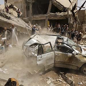 A car falls as it is being lifted by a crane at the site of a Saudi-led air strike in Yemen's capital Sanaa September 21, 2015. More than 4,500 Yemeni have been killed since the Saudi-led alliance began military operations in March, in what they said was an attempt to stop the Iranian-allied Houthi group from expanding in Yemen and to restore President Abd-Rabbu Mansour Hadi, who had been pushed into exile in Saudi Arabia.  (Khaled Abdullah/Reuters)