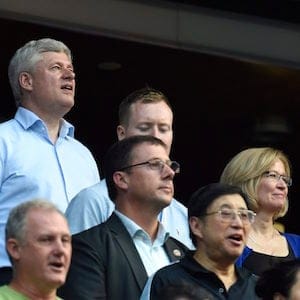 Conservative Leader Stephen Harper and his family sing the national anthem as the Toronto Blue Jays prepare to take on the Cleveland Indians during American League baseball action in Toronto on Monday, August 31, 2015. THE CANADIAN PRESS/Frank Gunn
