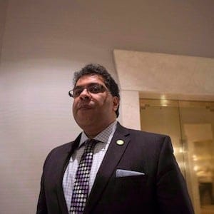 Calgary Mayor Naheed Nenshi waits to speak to the media as he the attends Big Cities summit hosted by the Federation of Canadian Municipalities in Toronto on Thursday February 5 2015. Nenshi is criticizing Alberta Premier Jim Prentice for spending millions to hold an early provincial election after refusing to restore funding for more child death investigations. THE CANADIAN PRESS/Chris Young