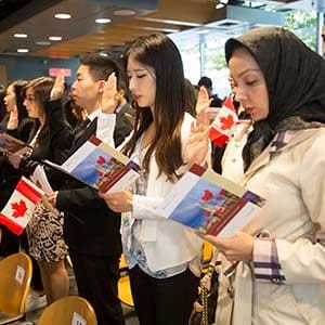 Oct 6 2015--Vancouver BC--Citizenship ceremony: New Canadians take the citizenship oath during a ceremony in Vancouver. (Photographs by Brian Howell)