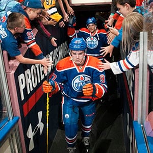 Connor McDavid #97 of the Edmonton Oilers makes his way to the ice prior to a preseason game against the Calgary Flames on September 21, 2015 at Rexall Place in Edmonton, Alberta, Canada. (Andy Devlin/NHLI/Getty Images)