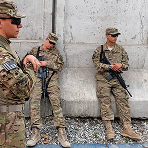 US soldiers of the Combined Team Nangarhar of the CT Bastogne, 1st Brigade Combat Team, 101st Airborne Division (Air Assault) of the United States take a break after an award ceremony at Forward Operating Base, Finley Shields in Jalalabad in Nangarhar province on April 6, 2013.  An estimated 100,000 foreign troops have been fighting the Taliban for the past 11 years and are due to leave Afghanistan by December 31, 2014 to be replaced by a smaller contingent to train and advise their local counterparts. (Manjunath Kiran/AFP/Getty Images)