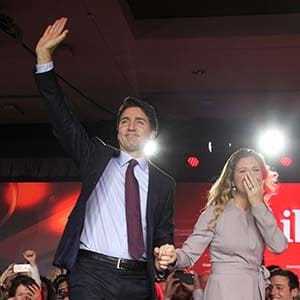 Liberal Party leader Justin Trudeau waves while accompanied by his wife Sophie Gregoire as he arrives to give his victory speech after Canada's federal election in Montreal, Quebec, October 19, 2015. (Photograph by Roger LeMoyne)