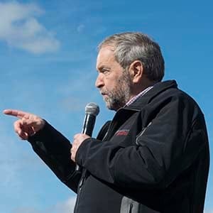 NDP leader Tom Mulcair speaks to supporters during a visit to a dairy farm Saturday, October 3, 2015 in Upton, Que. (Ryan Remiorz/CP)