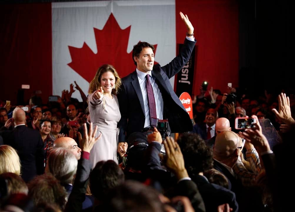 Liberal Party leader Justin Trudeau waves while accompanied by his wife Sophie Gregoire as he gives his victory speech after Canada's federal election in Montreal, Quebec, October 19, 2015. (Jim Young/Reuters)