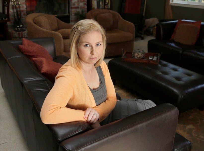 Breyan Harris, a lifelong non-smoker who was recently diagnosed with lung cancer, posses at her home in Fair Oaks, Calif., Monday, June 16, 2014.  (AP Photo/Rich Pedroncelli)