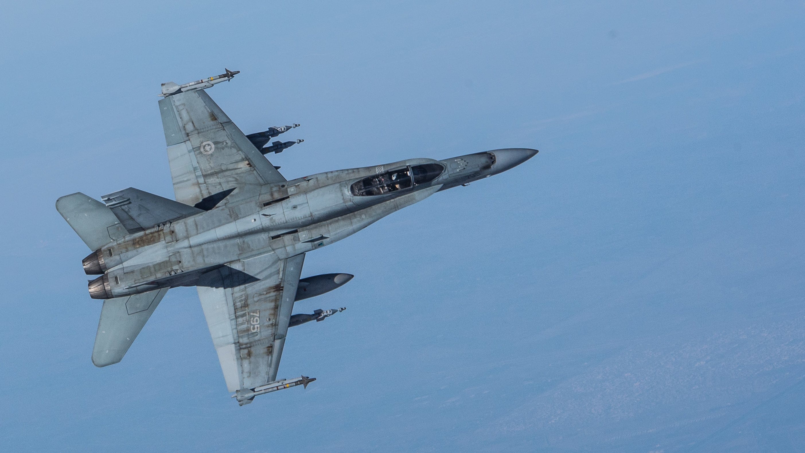 A CF-18 Hornet escorts a CC-150 Polaris after being refueled during Operation IMPACT on February 4, 2015.

Photo: Canadian Forces Combat Camera, DND

Un CF-18 Hornet escorte un CC-150 Polaris après avoir été ravitaillé pendant l’opération Impact, le 4 février 2015.

Photo : Caméra de combat des Forces canadiennes, MDN
IS01-2015-0002-029