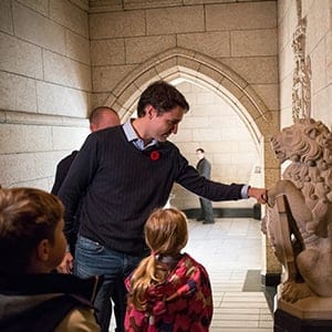 Prime Minister-designate Justin Trudeau is joined by Xavier and Ella-Grace as they raise the Peace Tower flag the morning before he is sworn in as Canada's 23rd Prime Minister. November 4, 2015. (Adam Scotti/Liberal Party of Canada)