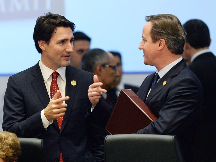 Prime Minister Justin Trudeau talks to British Prime Minister David Cameron at the start of a plenary session at the G20 Summit in Antalya, Turkey on Sunday, Nov. 15, 2015. (Sean Kilpatrick/CP)