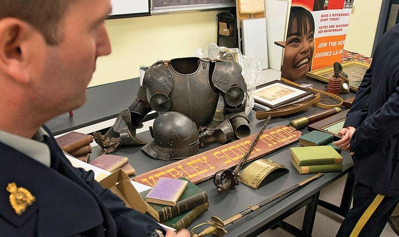 The RCMP display some of the hundreds of historical artifacts discovered at a suburban home, at a news conference in Halifax on Friday, Jan. 25, 2013. John Mark Tillmann has been charged with possessing stolen property. THE CANADIAN PRESS/Andrew Vaughan