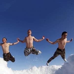 Soldiers of China's People's Liberation Army (PLA) jump as part of their winter training in  temperature of negative 26 degrees Celsius at China's border with Russia in Heihe, Heilongjiang province, December 14, 2015. (Reuters)