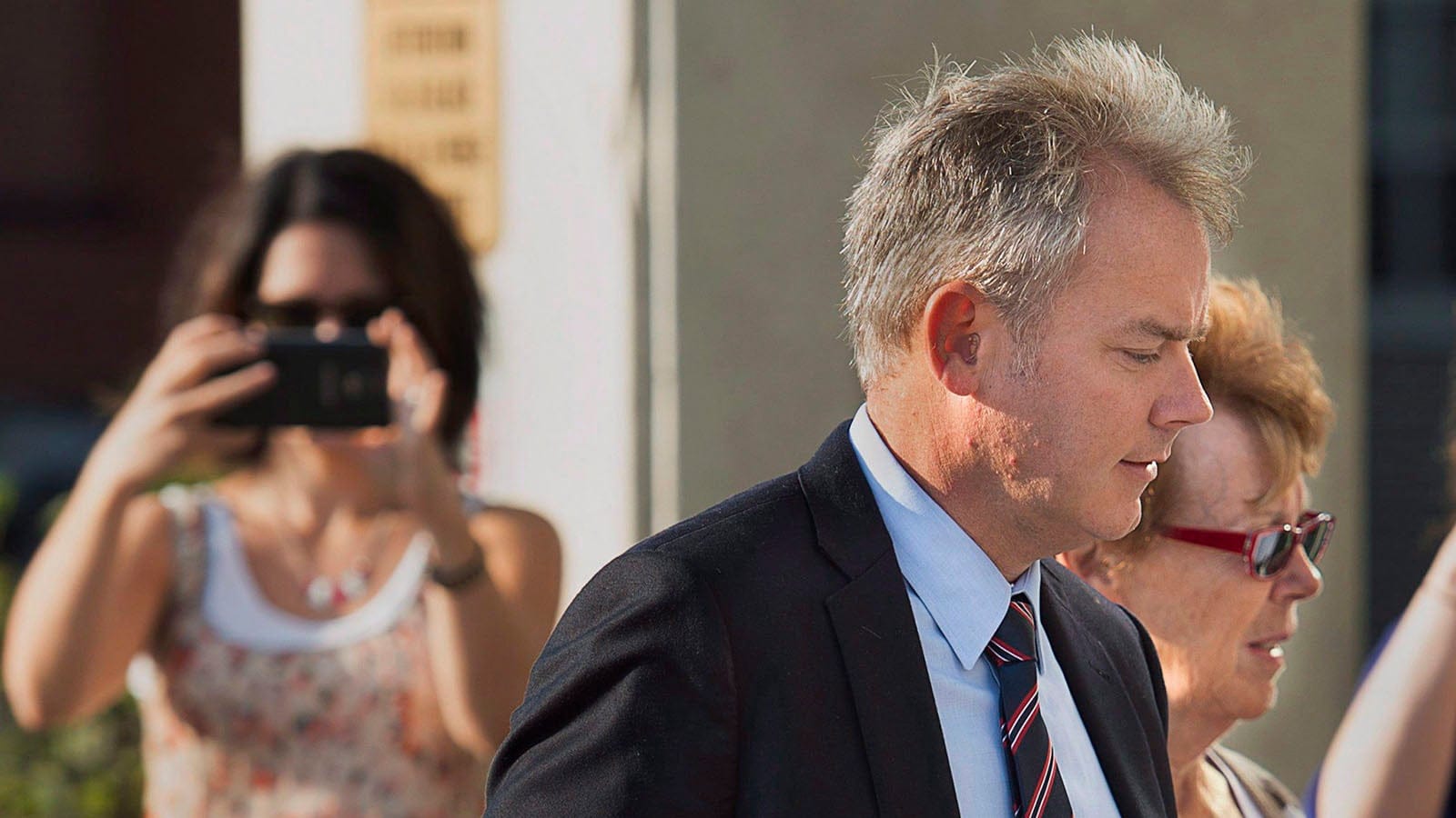 Dennis Oland, accompanied by his mother Constance Oland, arrives for the start of his trial in Saint John, N.B. on Wednesday, Sept. 16, 2015. Oland is charged with second degree murder in the death of his father. Richard Oland, 69, was found dead in his Saint John office on July 7, 2011. (Andrew Vaughan/CP)
