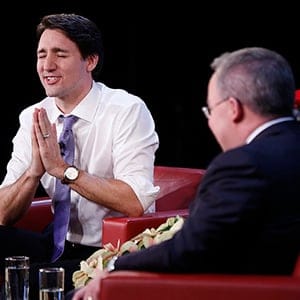 Canada's Prime Minister Justin Trudeau speaks with Maclean's Magazine political writer Paul Wells at the National Arts Centre in Ottawa December 16, 2015. (Photograph by Blair Gable)