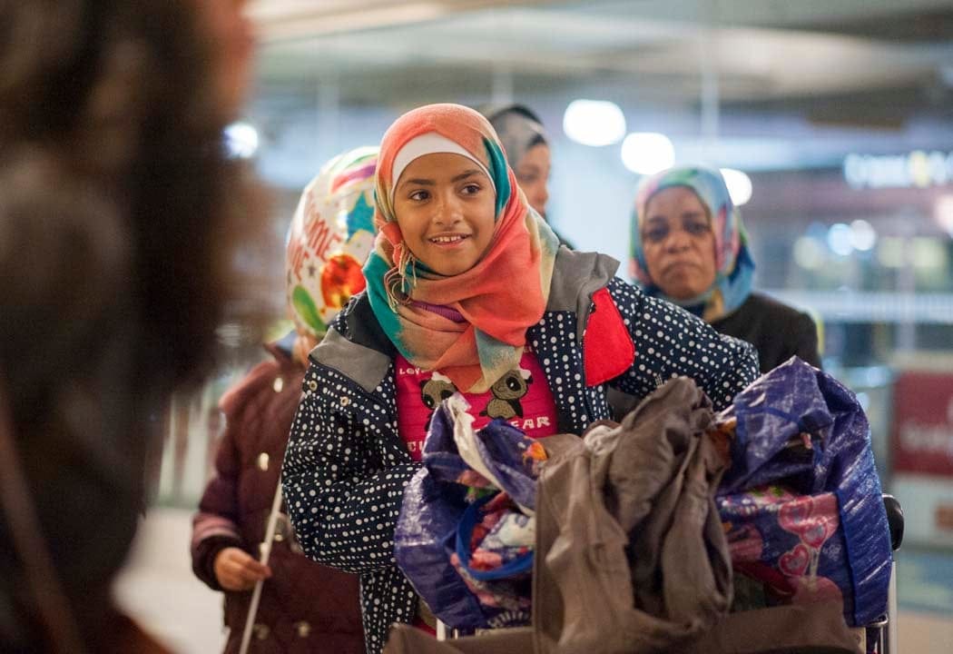 Hanien Falah, a refugee from Syria, walks with her family to the parking lot at the Toronto Pearson International Airport on Thursday, Dec. 10, 2015 after arriving from Frankfurt, Germany. (Photograph by Hannah Yoon)