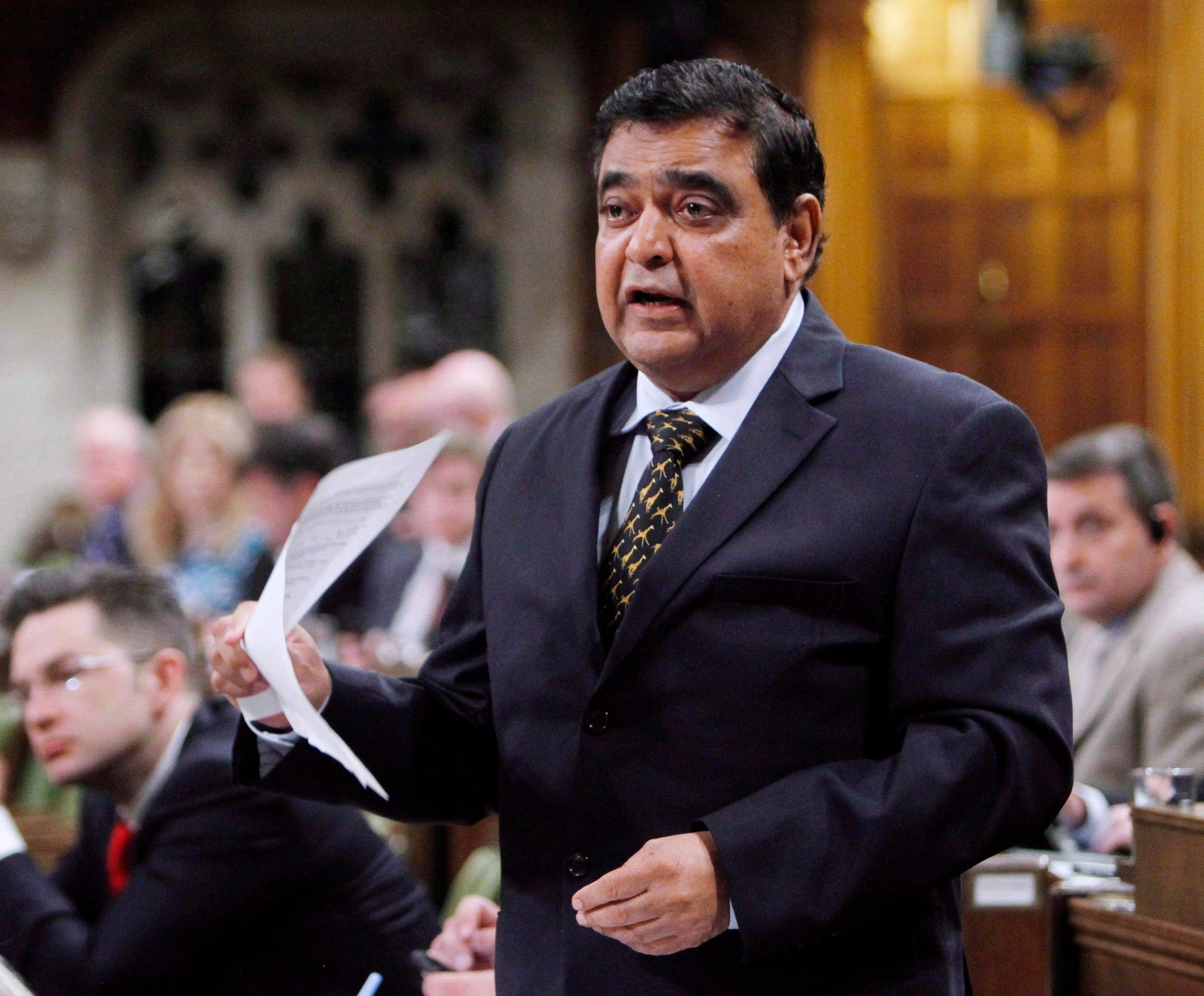 Conservative MP Deepak Obhrai stands in the House of Commons during question period in Ottawa, Friday, May 30, 2014. (Fred Chartrand/CP)
