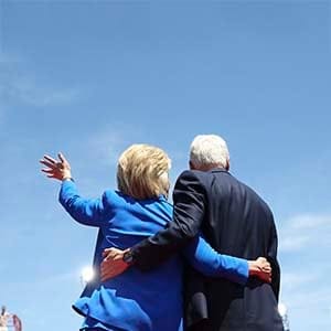Hillary Rodham Clinton is met on stage by her husband, former President Bill Clinton, during a campaign rally on Roosevelt Island in New York, June 13, 2015. Clinton kicked off her 2016 campaign for president on Saturday. (Doug Mills/The New York Times/Redux)