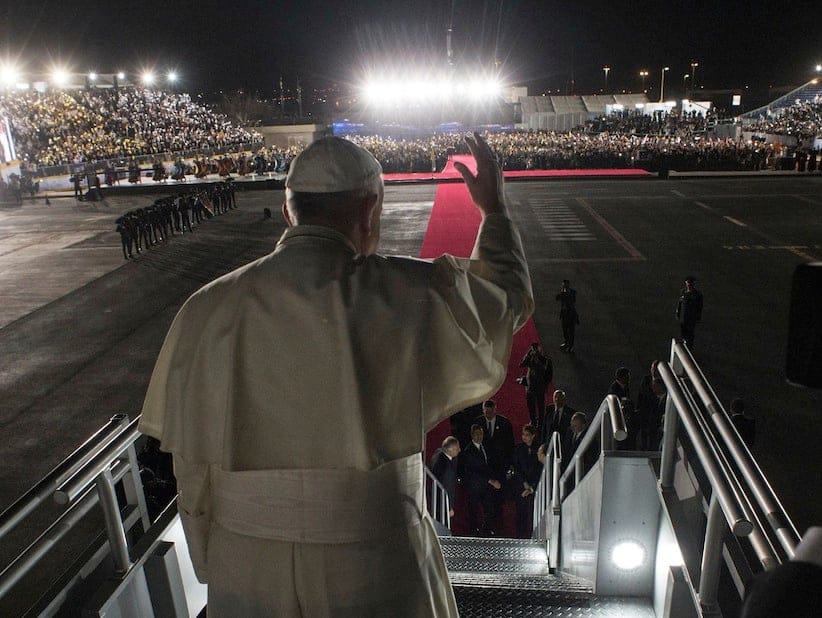 Pope Francis waves as he boards his flight to Rome during the farewell ceremony at Ciudad Juarez, Mexico. (L'Osservatore Romano/Pool Photo via AP)