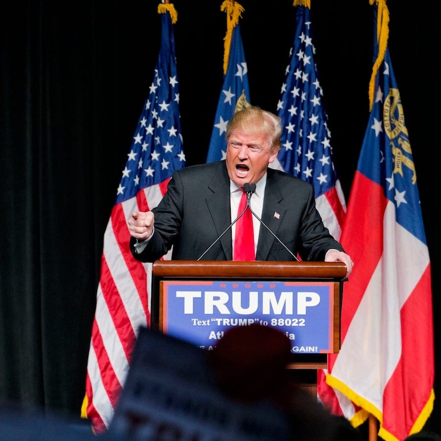 FILE - In this Feb. 21, 2016 file photo, Republican presidential candidate Donald Trump speaks at a campaign event in Atlanta. With its red, white and blue bunting, patriotic slogans and ubiquitous country songs, the presidential campaign marching through South Carolina and Nevada seems like an all-American affair. But it holds familiar overtones to Europeans watching anxiously from abroad. (AP Photo/David Goldman, File)