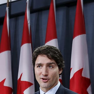 Canada's Prime Minister Justin Trudeau (2nd R) speaks during a news conference with Defence Minister Harjit Sajjan (L), International Development Minister Marie-Claude Bibeau (2nd L) and Foreign Minister Stephane Dion in Ottawa, Canada, February 8, 2016. REUTERS/Chris Wattie - RTX26116
