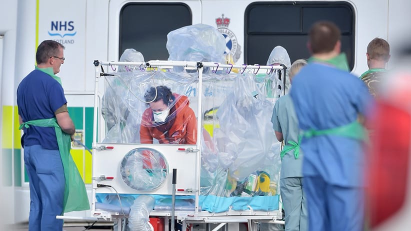 Pauline Cafferkey enters an isolation tent before  boarding a RAF Hercules  at Glasgow Airport on February 23,2016 in Glasgow,Scotland. The RAFHercules aircraft is transporting  her to London where she will be treated at the Royal Free Hospital for suspicion of Ebola for the third time.  (Jeff J Mitchell/Getty Images)
