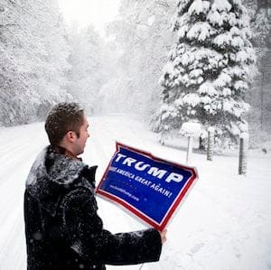 James Radcliffe, a volunteer for Republican presidential candidate Donald Trump, places a sign outside a home while walking through the snow knocking on doors in search of Trump supporters Friday, Feb. 5, 2016, in Londonderry, N.H. The twenty-two year old, from out-of-state whose never been involved in politics, is on the front lines of Trump’s ground war in New Hampshire, where the billionaire businessman is under intense pressure to win big. (AP Photo/David Goldman)