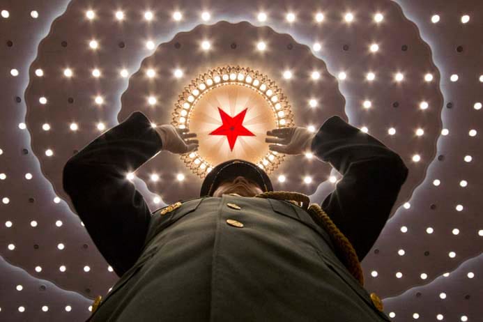 A military band conductor leads the band at the close of the annual National People's Congress held in Beijing's Great Hall of the People on Wednesday, March 16, 2016. (Ng Han Guan/AP)