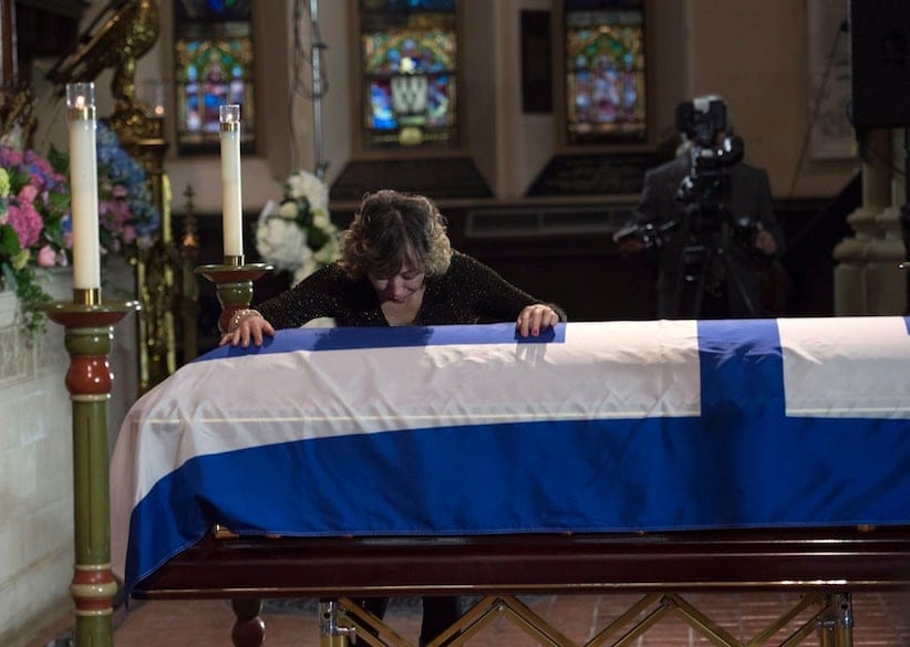 Former Toronto mayor Rob Ford's widow Renata touches her husband's casket at St. James Cathedral in Toronto on Wednesday, March 30, 2016. Ford died of cancer last week at the age of 46. THE CANADIAN PRESS/Nathan Denette