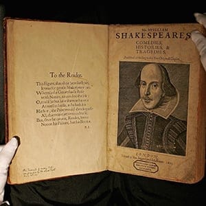 A Sotheby's employee handles a copy of William Shakespeare, The First Folio 1623 on July 7, 2006 in London, England. The most important book in English Literature, the First Folio edition of Shakespeare's plays (1623), will be offered in Sotheby's sale of English Literature &amp; History on July 13th, and is estimated to fetch GBP 2.5-3.5 million.  (Scott Barbour/Getty Images)