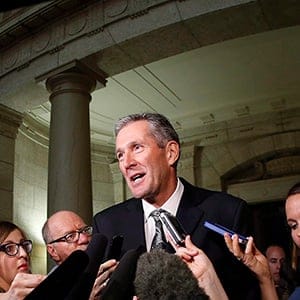 Manitoba Conservative and opposition leader Brian Pallister speaks to media after Manitoba Finance Minister Greg Dewar read the 2015 budget for the province at the Manitoba Legislature in Winnipeg, Thursday, April 30, 2015. THE CANADIAN PRESS/John Woods