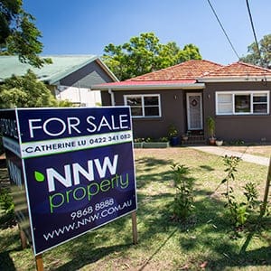 A "For Sale" sign stands on display outside a house in the suburb of Eastwood in Sydney, Australia, on Saturday, Jan. 11, 2014. Purchases by locally resident Chinese and those from mainland China are inflating housing bubbles in and around Sydney, where prices in some suburbs have surged as much as 27 percent in the past year. (Ian Waldie/Bloomberg/Getty Images)