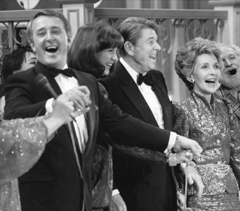 Former Prime Minister Brian Mulroney leads the chorus in singing an Irish song on stage with his wife, Mila, and U.S. President Ronald Reagan and First Lady Nancy Reagan  in Quebec City March 17, 1985.  (Bill Grimshaw, CP) Grimshaw)