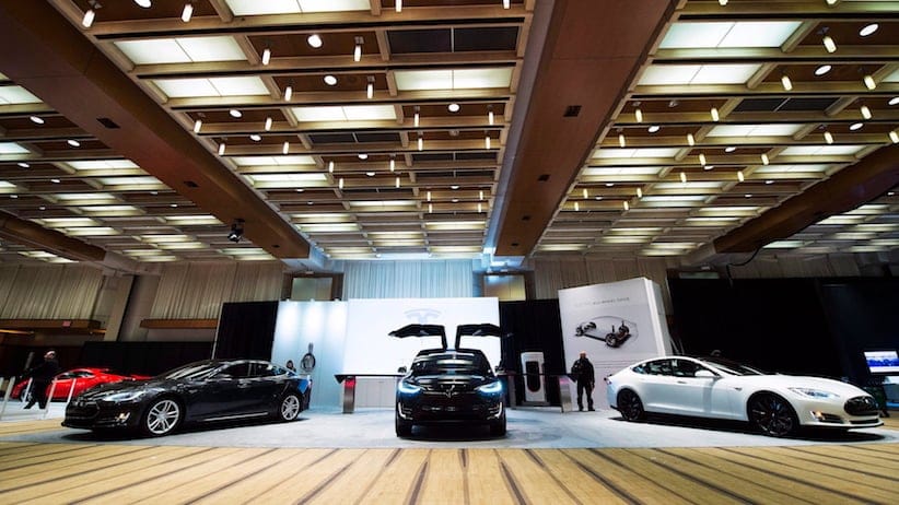Tesla vehicles are shown at the 2016 Canadian International Autoshow in Toronto on Thursday, February 11, 2016. THE CANADIAN PRESS/Nathan Denette