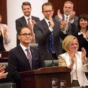 Alberta Finance Minister Joe Ceci, centre, receives a round of appause after delivering the 2015 provincial budget at the Legislative Assembly in Edmonton on Tuesday, Oct. 27, 2015. (Topher Seguin/CP)