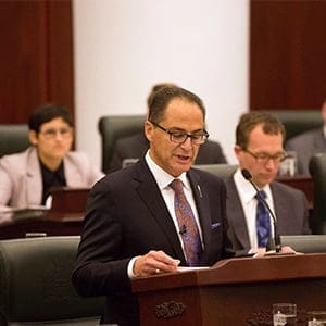 Alberta Finance Minister Joe Ceci, centre, delivers the 2015 provincial budget in Edmonton on Tuesday, Oct. 27, 2015. (Topher Seguin/The Canadian Press)