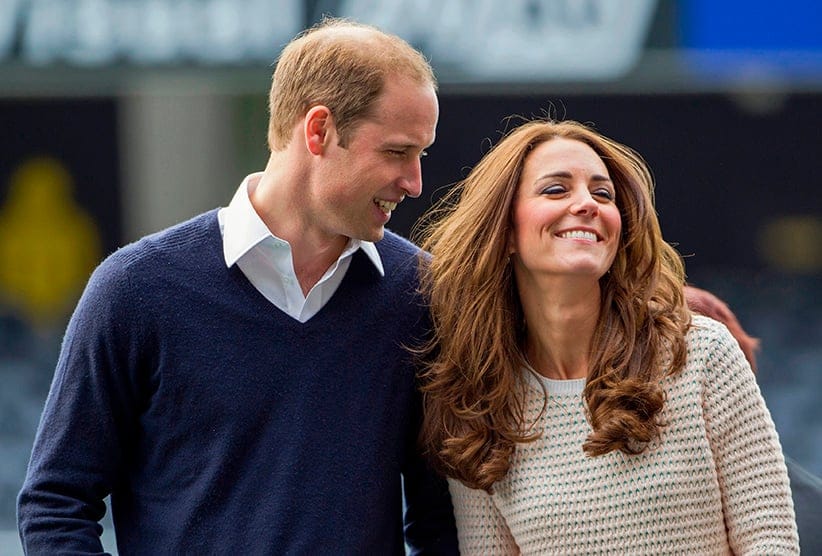 Catherine (R), Duchess of Cambridge, and her husband, Britain's Prince William, laugh as they watch a young players' rugby tournament held at Forsyth Barr Stadium in Dunedin April 13, 2014. Prince William and his wife are undertaking a 19-day official visit to New Zealand and Australia with their son, Prince George. (David Rowland/Reuters)