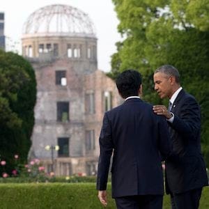 U.S. President Barack Obama and Japanese Prime Minister Shinzo Abe speak with the Atomic Bomb Dome seen at rear at the Hiroshima Peace Memorial Park in Hiroshima, western Japan, Friday, May 27, 2016. Obama on Friday became the first sitting U.S. president to visit the site of the world's first atomic bomb attack, bringing global attention both to survivors and to his unfulfilled vision of a world without nuclear weapons. (AP Photo/Carolyn Kaster)