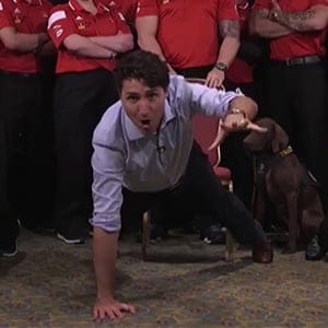 Screen grab of a video where Prime Ministry Justin Trudeau is seen doing one-arm pushups with Invictus Games athletes.