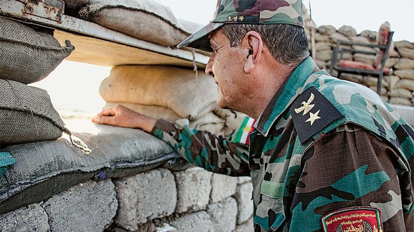 Al Khidhir, Iraq   Colonel Abdularrahman Hassan, a commander of the Zeravani forces, keeps an eye on Islamic State positions at the frontlines near Mosul. Canadian special forces stationed in the Kurdistan Region of northern Iraq have focused their training and supply mission on the Zeravani, a security force attached to the Kurdistan Region's  Interior Ministry and  considered loyal to the Kurdistan Democratic Party, or KDP.  Other political groups complain that Canada has played favourites, arming and training forces that have political ties at the expense of Kurdish unity.(Photograph by Adnan R. Khan)