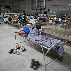Residents of Fort McMurray get some rest in on cots at the Bold Centre in Lac La Biche, AB after being evacuated from fires that have taken over northern Alberta on Wednesday, May 04, 2016 . (Photograph by Chris Bolin)