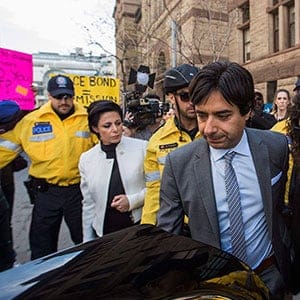 Former CBC host Jian Ghomeshi leaves court after signing a peace bond with his sister Jila, right, and his lawyer Marie Henein, left, in Toronto, Wednesday, May 11, 2016. (Mark Blinch/CP)