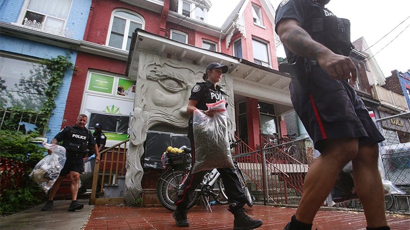 Cannawide marijuana dispensary is raided by Toronto Police officers in Toronto.  Toronto Police issued warnings a month ago to numerous dispensaries operating outside of current Canadian marijuana laws and as part of Project Claudia are now raiding the shops. COLE BURSTON/CP