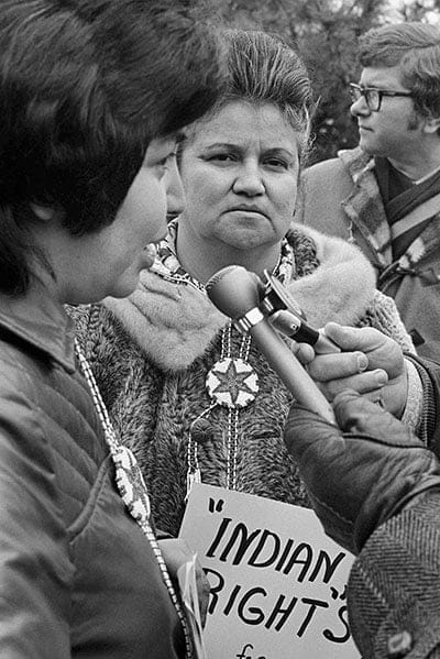 Jenny Margetts (left) of Edmonton, and Monica Turner of Geraldton, Ontario, co-spokespersons for an Indian Rights for Indian Women's group, speak to reporters in front of the Parliament Buildings on February 21, 1973, protesting what they consider the Indian Act's discrimination against women.  The Act forces Indian women to give up their status as treaty Indians when they marry whites or non-treaty Indians. (Bill Brennan/CP)